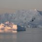 Sunset shining on an iceberg in the Arctic Ocean
