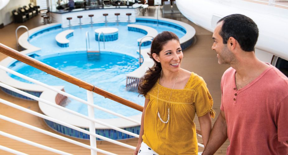disney cruise on top deck couple walking around pool